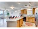 Bright kitchen with a large island, ample counter space, and an open concept design at 13456 Via Varra # 315, Broomfield, CO 80020