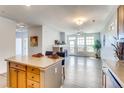 Beautiful living room with fireplace and an open floor plan that connects seamlessly to the kitchen at 13456 Via Varra # 315, Broomfield, CO 80020