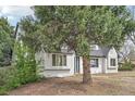 Charming single-Gathering home with a white brick exterior and a gray roof at 796 S Bristol St, Lakewood, CO 80228