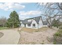 Charming single-Gathering home with a white brick exterior and a gray roof at 796 S Bristol St, Lakewood, CO 80228