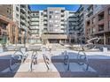 Inviting courtyard with seating, planters, and public art in front of a modern building at 20 Wilcox St # 308, Castle Rock, CO 80104