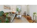 Bright and airy living room with comfortable seating and stylish decor at 2765 W Denver Pl, Denver, CO 80211