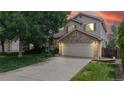 Charming two-story home with a brick facade and well-maintained front yard at 4164 E 135Th Pl, Thornton, CO 80241