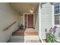 Close-up of the front door showing a classic design, wood accents, and a welcoming entryway at 1367 Teller St, Lakewood, CO 80214