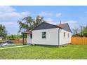 Beautiful home with a freshly painted white exterior, clean lawn, and clear blue skies at 2 S Knox Ct, Denver, CO 80219