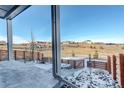 Backyard view of a sprawling landscape with a privacy fence and beautiful Colorado scenery at 11063 Shining Star Cir, Parker, CO 80134