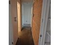 Hallway featuring access to multiple rooms in the house at 2597 S Dillon St, Aurora, CO 80014
