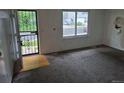 Spacious living room with a window overlooking the neighborhood at 2597 S Dillon St, Aurora, CO 80014