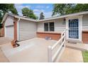 Charming single-story home with accessible ramp to front door and manicured landscaping at 3272 S Joplin Ct, Aurora, CO 80013