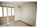 Bright room with double folding doors, plush carpet, and neutral wall color at 2090 S Hannibal Way # C, Aurora, CO 80013