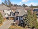 Beautiful home featuring stone accents, a two-car garage, and established trees at 6875 Northstar Ct, Castle Rock, CO 80108