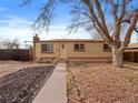 Charming single-story brick home featuring a well-manicured front yard and a cozy, inviting entrance at 8881 Judson St, Westminster, CO 80031