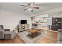 Open living room with hardwood floors and a view of the kitchen at 2042 S Josephine St # 2, Denver, CO 80210