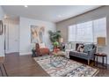 Living room with hardwood floors, comfortable seating, and stylish decor at 3430 N Cook St, Denver, CO 80205