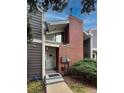 Entry to townhome with updated siding and brick chimney at 6625 W 84Th Cir # 48, Arvada, CO 80003