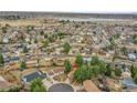 Aerial view of a neighborhood showcasing mature trees and single-Gathering homes at 18022 E Loyola Pl, Aurora, CO 80013