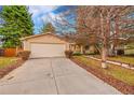 Single-Gathering home with a big driveway, spacious two car garage and appealing curb appeal at 18022 E Loyola Pl, Aurora, CO 80013