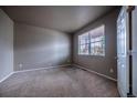 Neutral bedroom with carpet, and a window offering natural light at 19347 E 65Th Ave, Aurora, CO 80019