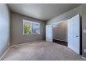 Neutral bedroom with carpet, closet, and a window offering natural light at 19347 E 65Th Ave, Aurora, CO 80019