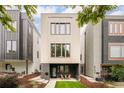 Modern home featuring unique architectural details and a well-manicured front yard at 2736 N Clay St, Denver, CO 80211