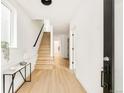 Bright foyer showcasing hardwood floors, stairs, and modern decor at 2736 N Clay St, Denver, CO 80211