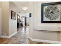 Inviting entryway with tile flooring and view into the spacious living area at 8559 W 93Rd W Ct, Broomfield, CO 80021