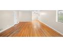 Bright living room with beautiful hardwood flooring and neutral walls at 10505 Lowry Pl, Aurora, CO 80010