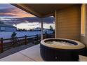 Relaxing hot tub on a covered patio with scenic views of the lush surroundings at 5211 Routt Ct, Arvada, CO 80002