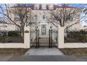 Elegant home exterior with iron gate and stone steps at 930 E 7Th Ave, Denver, CO 80218