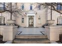 Inviting front entrance with tiled patio and ornate door at 930 E 7Th Ave, Denver, CO 80218