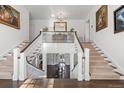 Stunning double staircase with white railings and hardwood floors at 930 E 7Th Ave, Denver, CO 80218