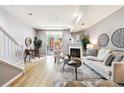 Bright living room featuring a fireplace, balcony, and modern decor at 3030 Wyandot St # 4, Denver, CO 80211
