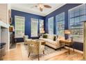Stylish living room with hardwood floors, ample natural light, and elegant decor at 9486 Elmhurst Ln # D, Highlands Ranch, CO 80129
