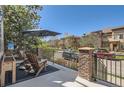 Inviting outdoor patio featuring comfortable seating, shade, and a view of the neighborhood at 9486 Elmhurst Ln # D, Highlands Ranch, CO 80129
