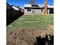 This backyard features a partial artificial turf, space and endless possibilities at 16136 E Exposition Dr, Aurora, CO 80017