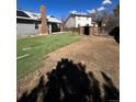 This backyard features a partial artificial turf, space, shed and endless possibilities at 16136 E Exposition Dr, Aurora, CO 80017