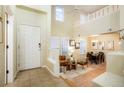 Open floor plan showing the entry way, living room and dining area with beautiful bright neutral paint at 7777 E 23Rd Ave # 401, Denver, CO 80238