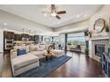 Open-concept living room featuring modern furnishings and lots of natural light at 27423 E Euclid Dr, Aurora, CO 80016