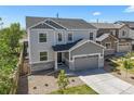 Stunning exterior of home featuring a manicured front lawn and welcoming curb appeal at 5078 S Quail St, Littleton, CO 80127