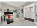 Home office with hardwood floors, french doors, and built-in desk at 10993 Ledges Rd, Parker, CO 80134