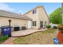 Private backyard featuring a stone patio, lush lawn, and a high-end outdoor grill at 20835 E 47Th Ave, Denver, CO 80249