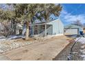 Ranch home with driveway, mature trees, and detached garage at 3720 S Hazel Ct, Englewood, CO 80110