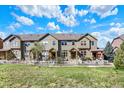 Charming townhome complex boasts a manicured lawn creating an inviting curb appeal at 3720 Pecos Trl, Castle Rock, CO 80109