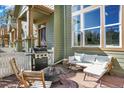 Relaxing patio area with comfortable seating, grill, and fire pit offering a delightful outdoor experience at 3720 Pecos Trl, Castle Rock, CO 80109