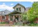 Charming two-story home featuring beautiful front porch and well-maintained landscaping at 3055 N York St, Denver, CO 80205