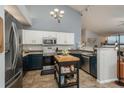 Contemporary kitchen features stainless steel appliances, granite countertops, and ample counter space at 3242 E 103Rd Dr # 602, Thornton, CO 80229