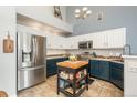 Modern kitchen with stainless steel appliances, two-tone cabinets, and a functional kitchen island at 3242 E 103Rd Dr # 602, Thornton, CO 80229