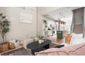 Open-concept living space with modern kitchen, cozy seating area and natural light at 2733 W 28Th Ave # 6, Denver, CO 80211