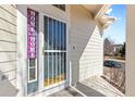 A welcoming front door with 'Home Sweet Home' decor at 13535 W 62Nd Ln, Arvada, CO 80004
