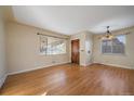 Hardwood floors and neutral walls create a bright dining area at 4157 Perry St, Denver, CO 80212